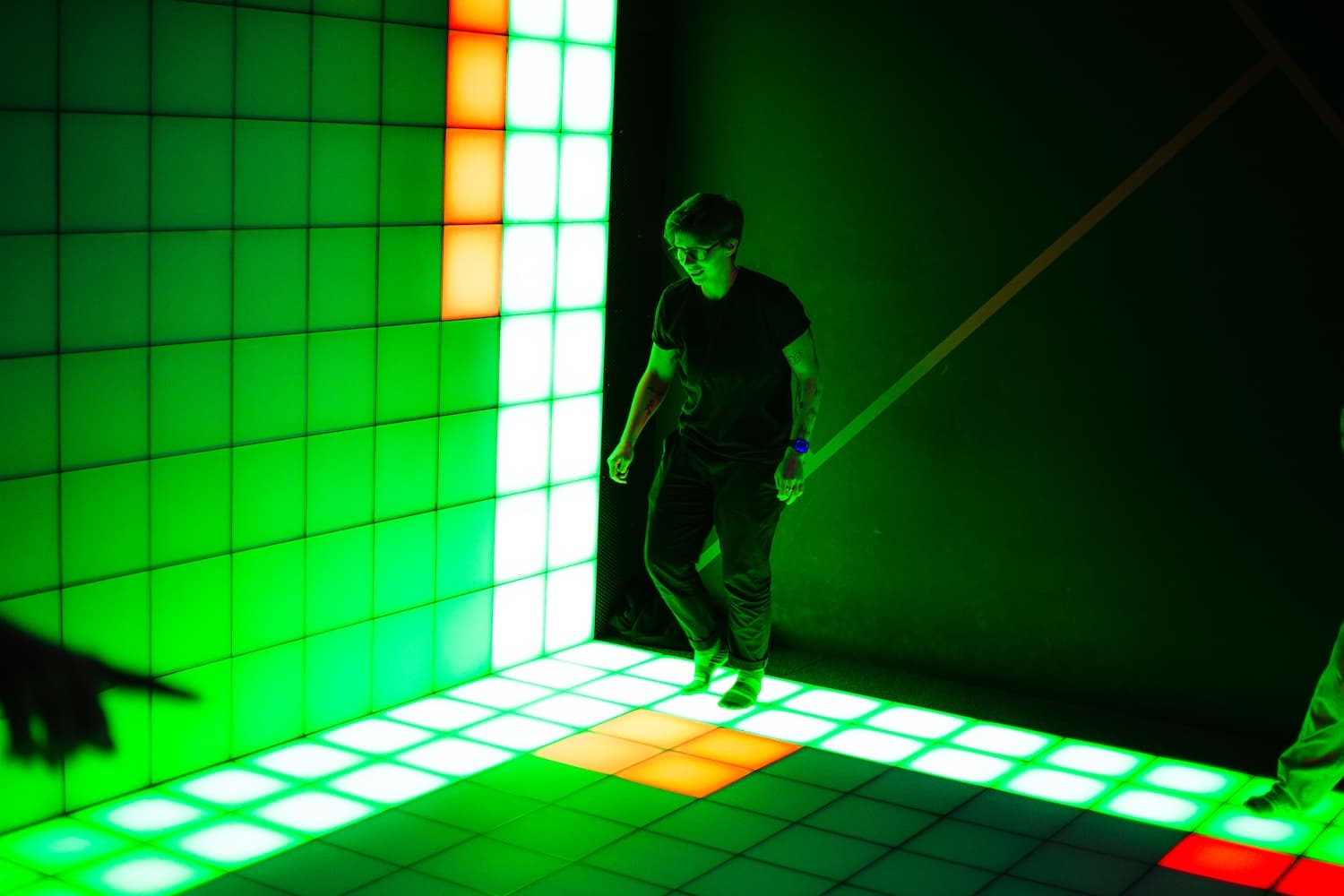 Group of friends playing together on the interactive LED floor