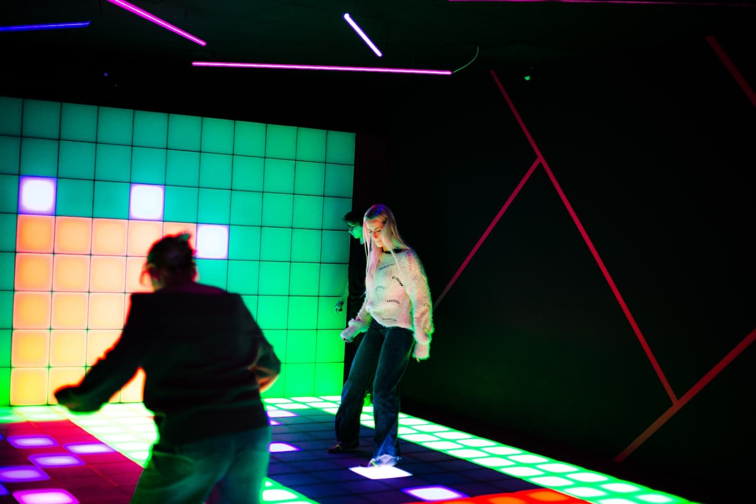 Close-up of LED pixel floor tiles illuminated during gameplay
